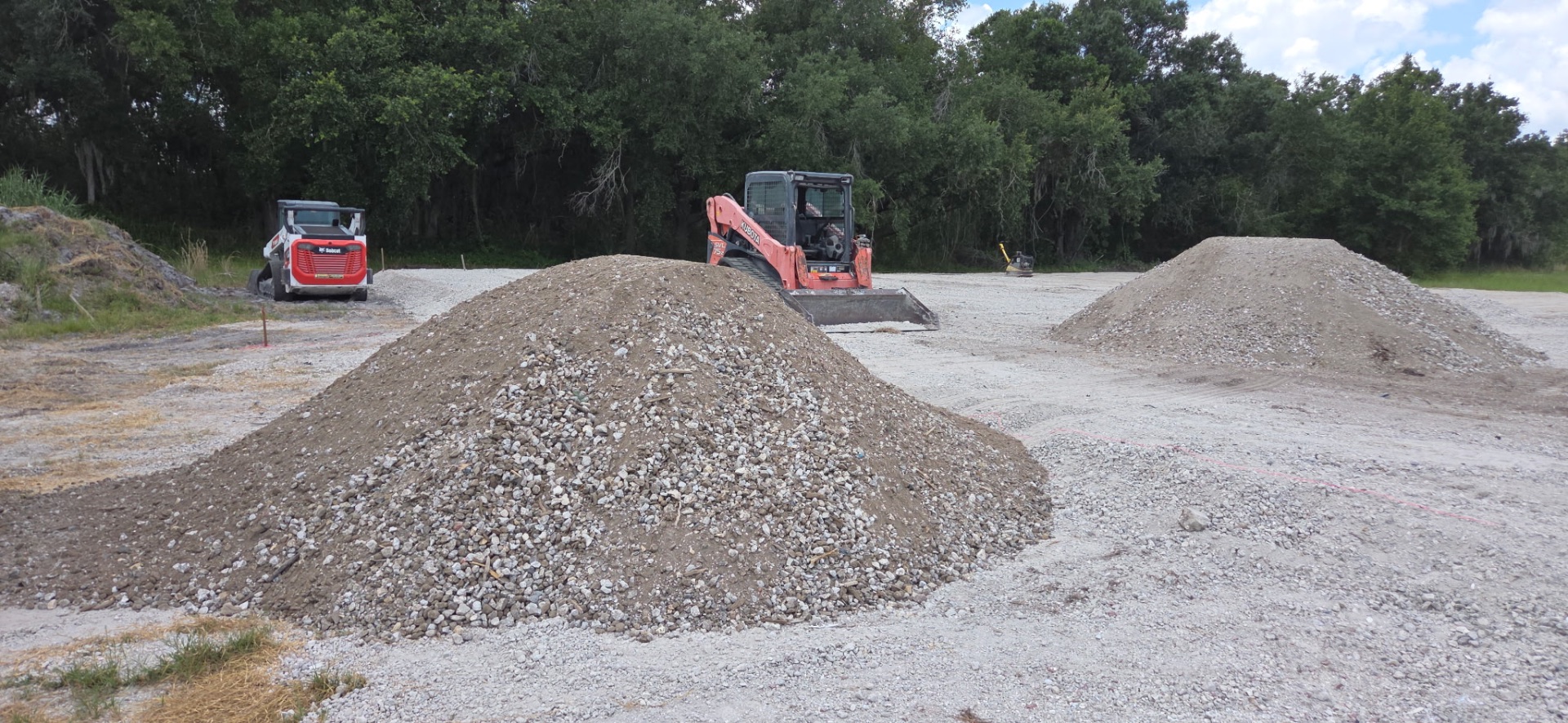 Aggregate and fill dirt piles at Bradenton jobsite